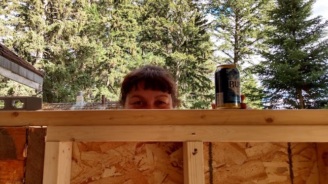 My sweetie temps me with a beer during renovations. Good thing I put the chainsaw down.